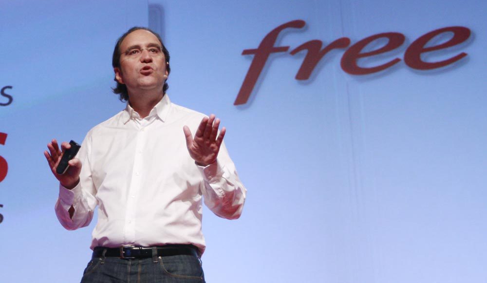 Xavier Niel, main shareholder of French broadband Internet provider Iliad, speaks during a news conference to launch the new Freebox Revolution (internet multimedia modem) in Paris December 14, 2010. The Freebox Revolution is designed by French designer Philippe Starck. REUTERS/Jacky Naegelen (FRANCE - Tags: BUSINESS SCI TECH)