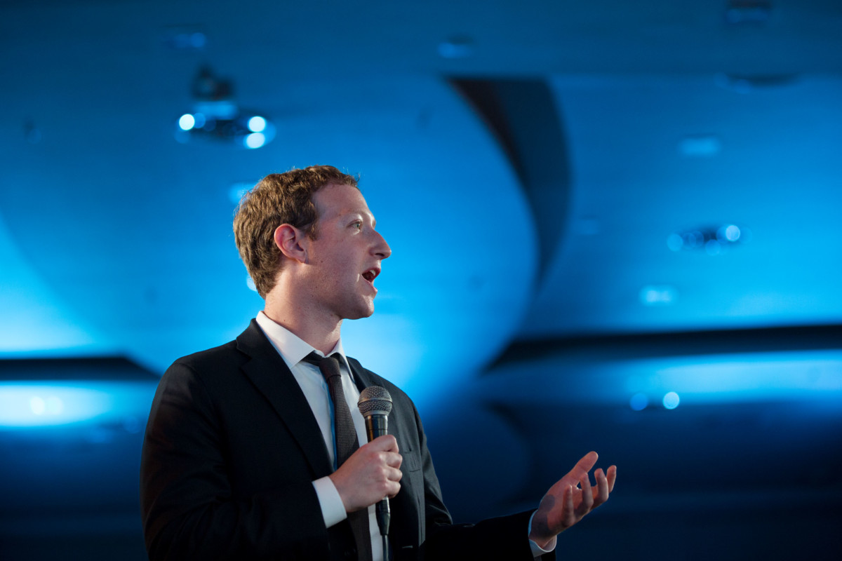 Facebook co-founder Mark Zuckerberg poses a question during the CEO Summit.</span> <span class=